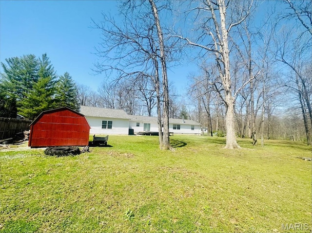 view of yard with an outbuilding and a barn