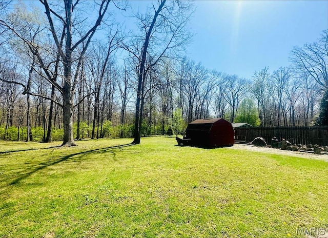 view of yard featuring an outbuilding and a shed
