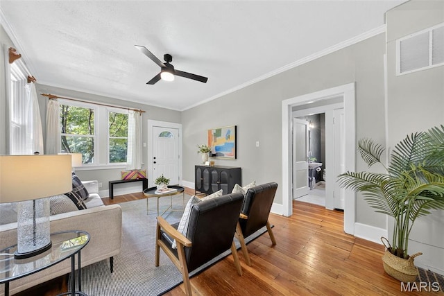 837 Tuxedo Blvd, Saint Louis, MO 63119 - living area with crown molding, a ceiling fan, and light wood-style flooring