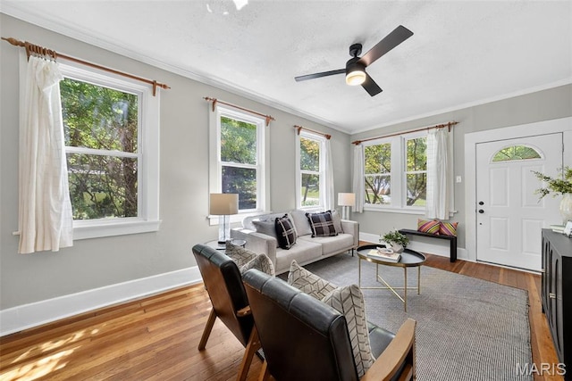837 Tuxedo Blvd, Saint Louis, MO 63119 - living area featuring ornamental molding, plenty of natural light, wood finished floors, and a ceiling fan