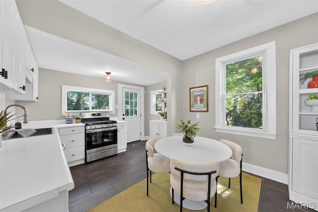 837 Tuxedo Blvd, Saint Louis, MO 63119 - dining room featuring dark tile patterned floors and baseboards