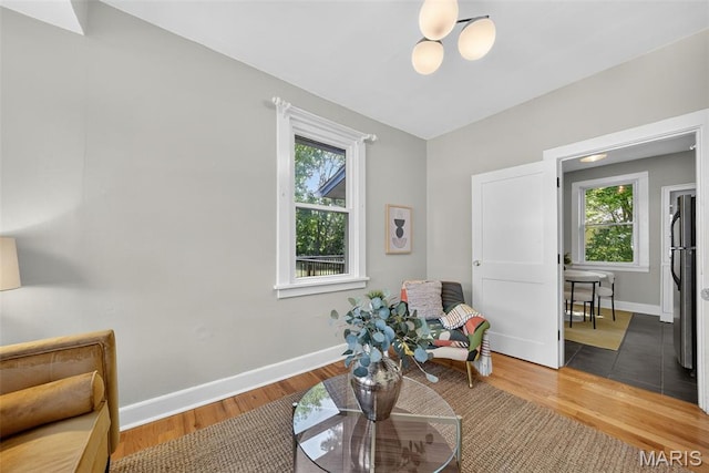 837 Tuxedo Blvd, Saint Louis, MO 63119 - sitting room featuring wood finished floors and a chandelier