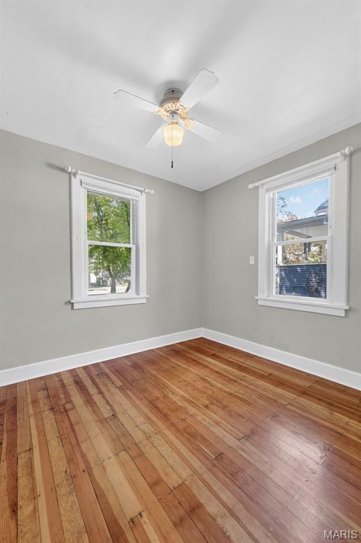 837 Tuxedo Blvd, Saint Louis, MO 63119 - spare room featuring wood-type flooring and a ceiling fan