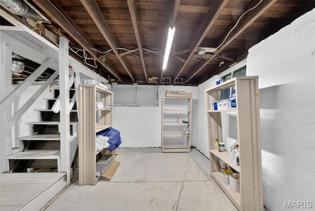 837 Tuxedo Blvd, Saint Louis, MO 63119 - unfinished basement featuring stainless steel fridge and stairway