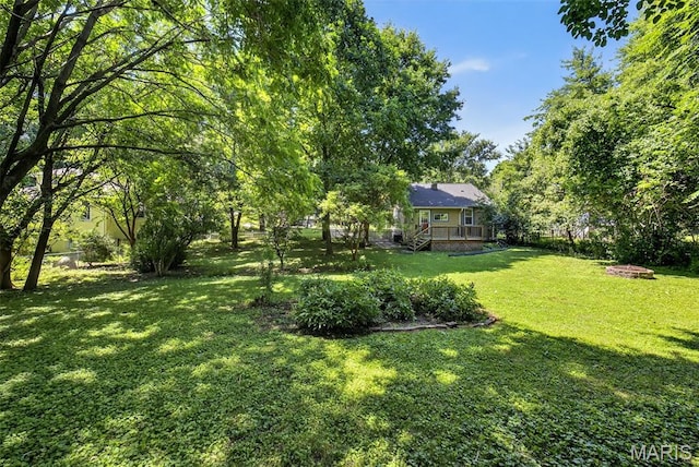 837 Tuxedo Blvd, Saint Louis, MO 63119 - view of grassy yard featuring a wooden deck