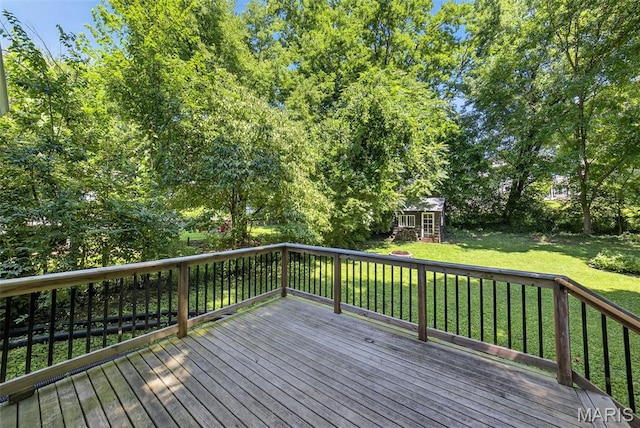 837 Tuxedo Blvd, Saint Louis, MO 63119 - deck with a lawn, an outdoor structure, and view of wooded area