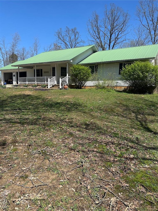 949 Ripley 21n-4, Doniphan, MO 63935 - ranch-style house featuring metal roof, a porch, a front yard, and a garage