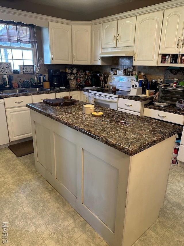 949 Ripley 21n-4, Doniphan, MO 63935 - kitchen featuring white electric stove, a sink, a kitchen island, decorative backsplash, and white cabinets