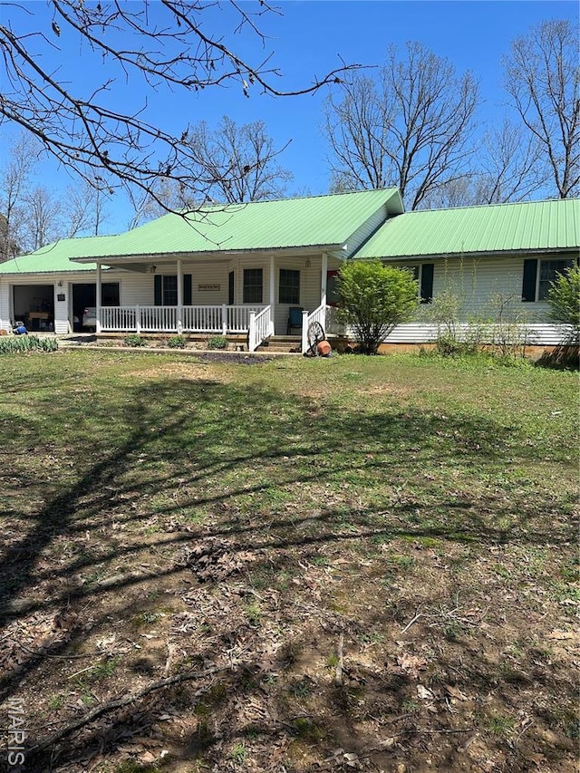 949 Ripley 21n-4, Doniphan, MO 63935 - view of front facade featuring a porch, metal roof, and a front lawn