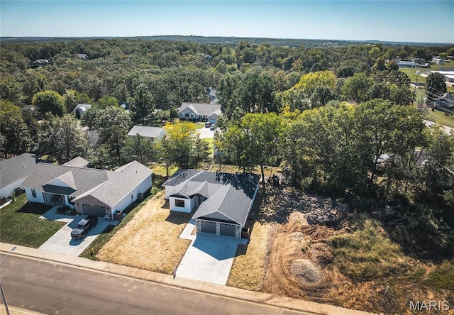 235 Sunny Dr, Rolla, MO 65401 - aerial perspective of suburban area with a heavily wooded area