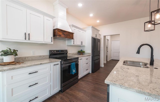 235 Sunny Dr, Rolla, MO 65401 - kitchen featuring electric range, a sink, black refrigerator, custom exhaust hood, and white cabinets