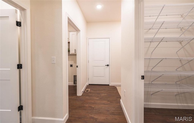 235 Sunny Dr, Rolla, MO 65401 - corridor featuring dark wood-type flooring and baseboards