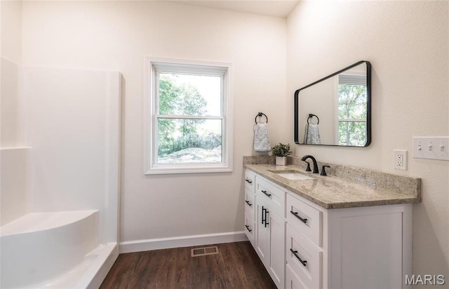 235 Sunny Dr, Rolla, MO 65401 - full bathroom featuring vanity, wood finished floors, and baseboards