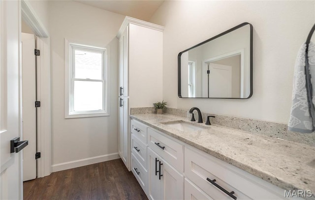 235 Sunny Dr, Rolla, MO 65401 - bathroom with vanity, wood finished floors, and baseboards