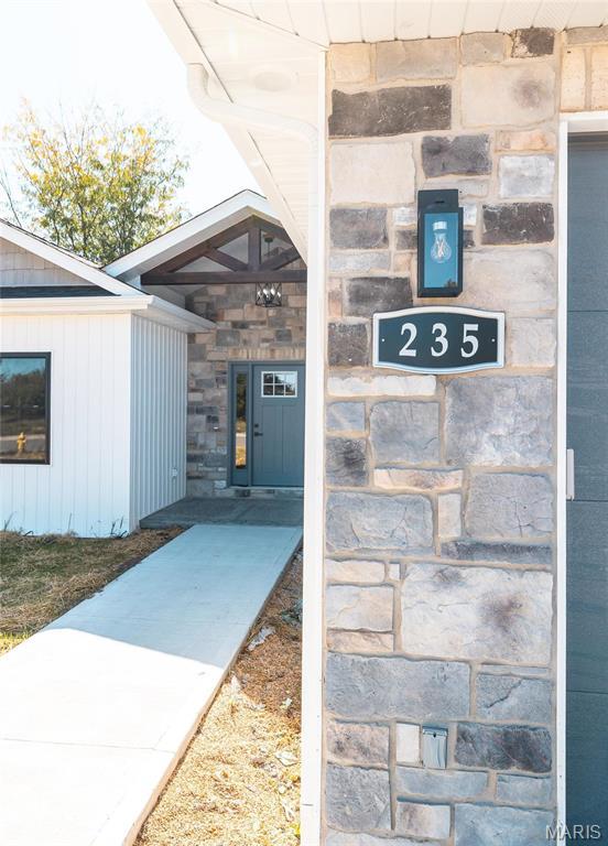 235 Sunny Dr, Rolla, MO 65401 - view of exterior entry featuring stone siding
