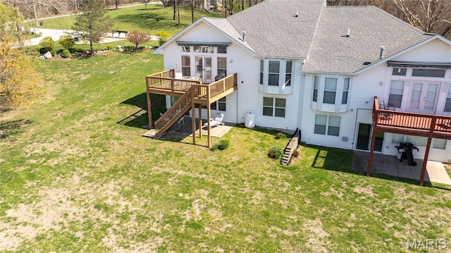 rear view of property with a wooden deck, stairs, roof with shingles, french doors, and a lawn