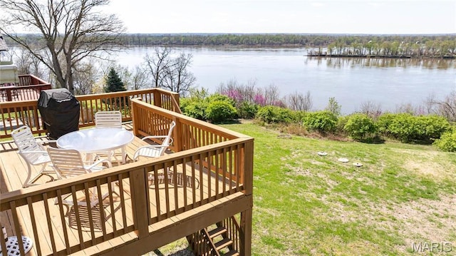deck featuring a water view and a yard