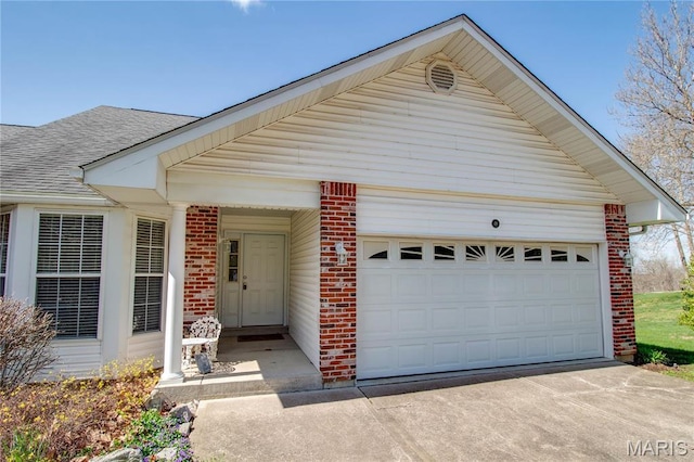 view of front of home featuring brick siding, roof with shingles, driveway, and an attached garage