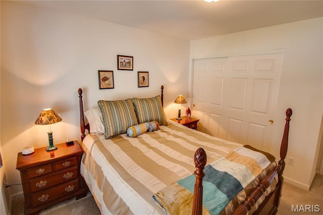 carpeted bedroom featuring a closet
