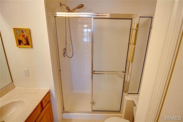 bathroom featuring a shower stall and vanity