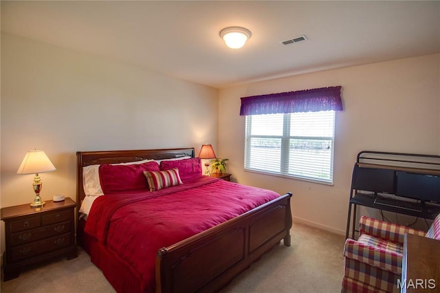 carpeted bedroom featuring baseboards