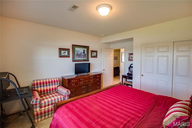 bedroom with carpet floors and a closet