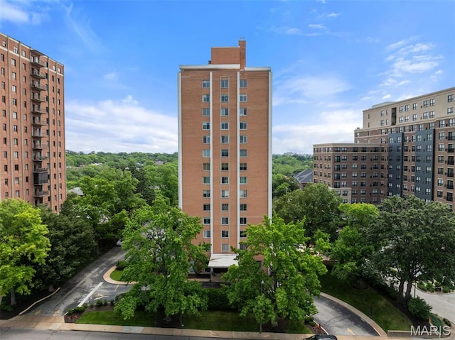 view of building exterior featuring a city view