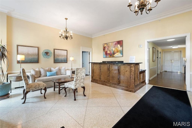 living room with a chandelier, crown molding, dark aggregate flooring, and baseboards