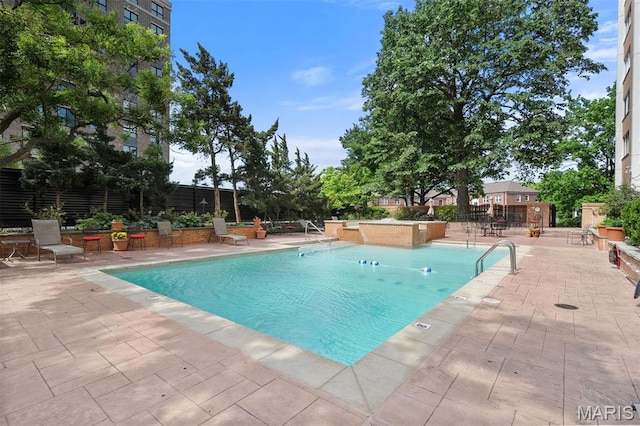 community pool with a patio