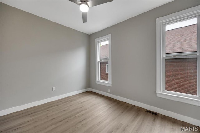 4311 Loughborough Ave, Saint Louis, MO 63116 - spare room featuring light wood-style floors and ceiling fan
