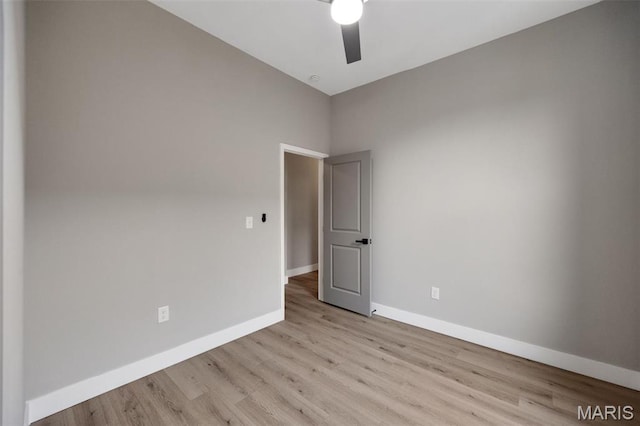 4311 Loughborough Ave, Saint Louis, MO 63116 - empty room with light wood finished floors and a ceiling fan