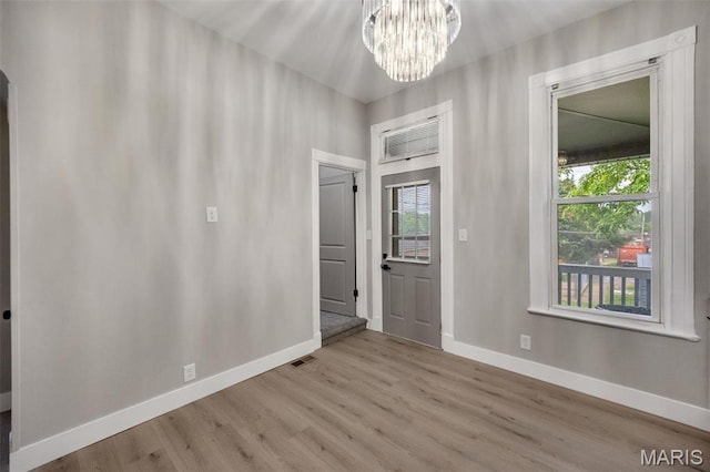 4311 Loughborough Ave, Saint Louis, MO 63116 - entrance foyer featuring wood finished floors and a chandelier