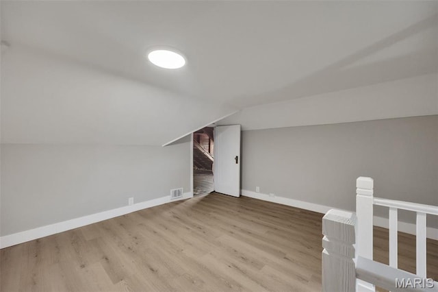 4311 Loughborough Ave, Saint Louis, MO 63116 - additional living space with wood finished floors and vaulted ceiling