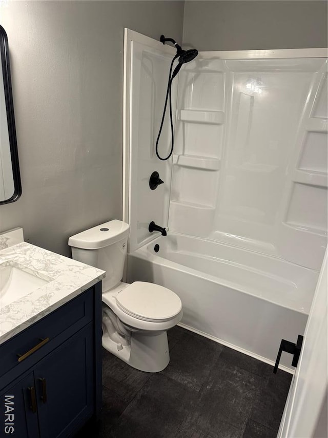bathroom featuring vanity, shower / bathtub combination, and toilet