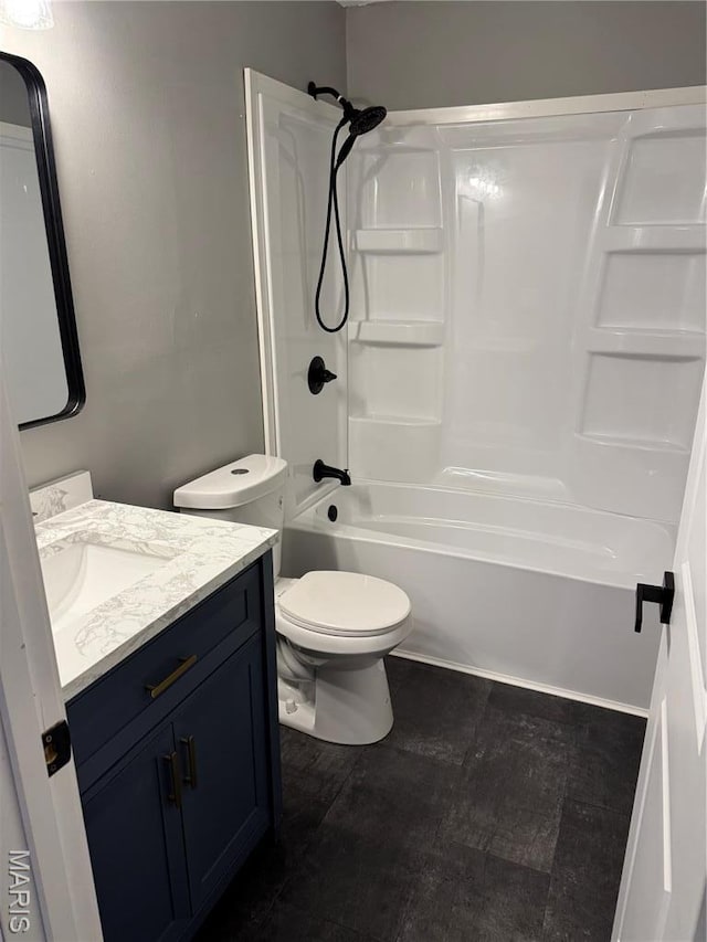 full bath with toilet, vanity, and tub / shower combination