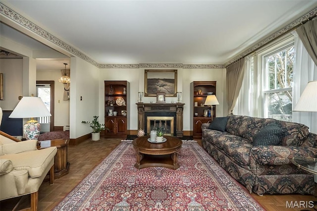 631 N Geyer Rd, Saint Louis, MO 63122 - living area with baseboards and a glass covered fireplace