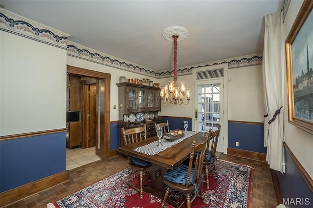 631 N Geyer Rd, Saint Louis, MO 63122 - dining area featuring a chandelier and wainscoting