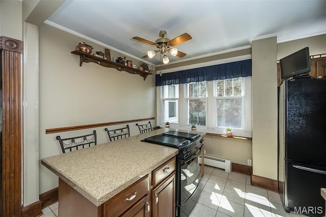 631 N Geyer Rd, Saint Louis, MO 63122 - kitchen featuring black appliances, a baseboard radiator, a ceiling fan, light tile patterned floors, and ornamental molding