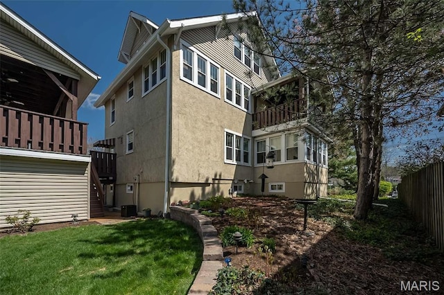 631 N Geyer Rd, Saint Louis, MO 63122 - view of side of home featuring stucco siding and a balcony