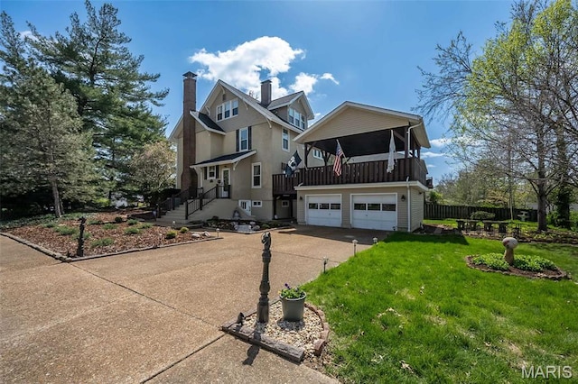 631 N Geyer Rd, Saint Louis, MO 63122 - view of front of home featuring concrete driveway, an attached garage, and a chimney
