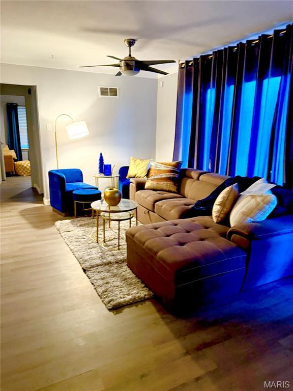 7008 Rohn Dr, Saint Louis, MO 63121 - living area featuring a ceiling fan and wood finished floors