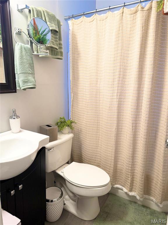 7008 Rohn Dr, Saint Louis, MO 63121 - bathroom with toilet and vanity