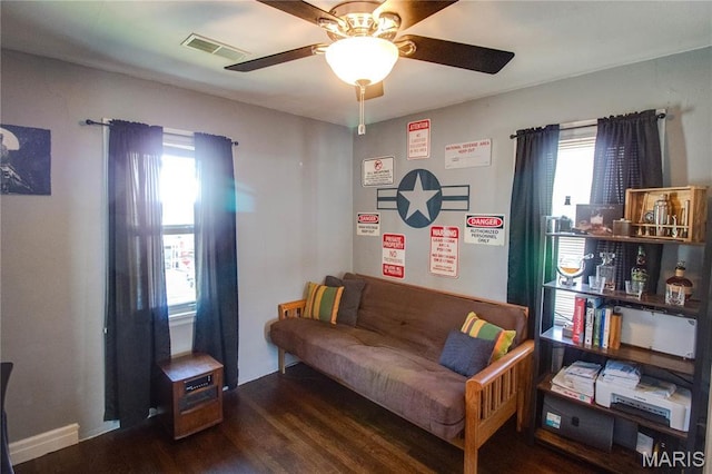 sitting room featuring healthy amount of natural light, wood finished floors, and a ceiling fan
