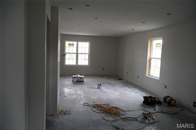 791 Main St, Lebanon, MO 65536 - empty room with plenty of natural light and concrete flooring