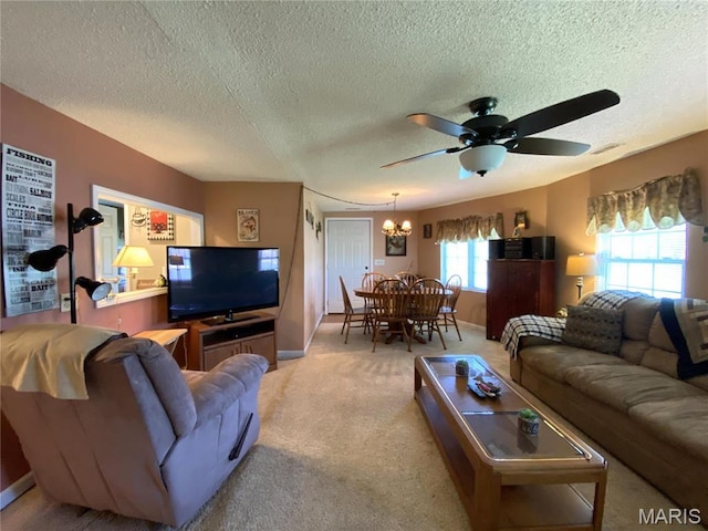 1920 Choctaw Path, Hermann, MO 65041 - carpeted living room featuring a textured ceiling, ceiling fan, a chandelier, and baseboards