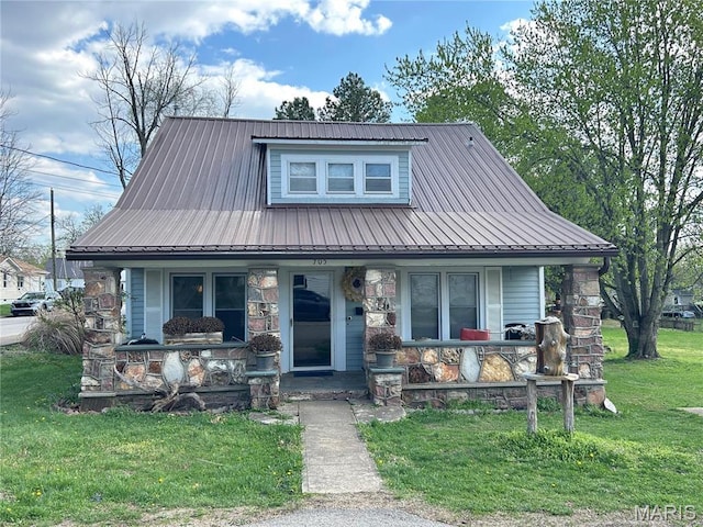 705 E Gibbs St, Salem, MO 65560 - view of front of property featuring covered porch, a front yard, stone siding, and metal roof