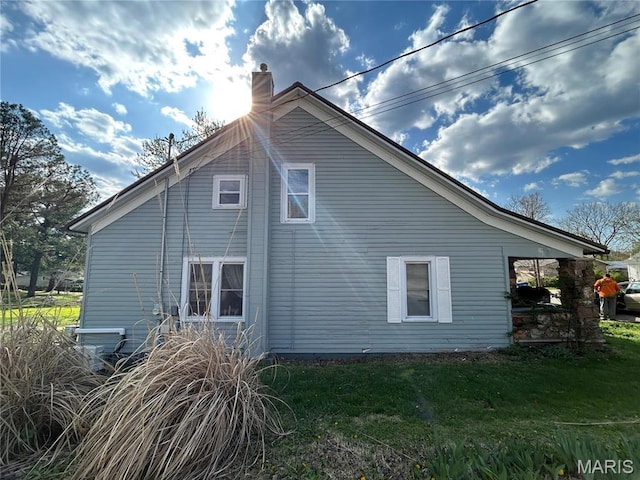 705 E Gibbs St, Salem, MO 65560 - view of side of property with a lawn and a chimney