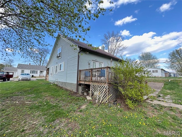 705 E Gibbs St, Salem, MO 65560 - back of property featuring a wooden deck, a chimney, and a yard
