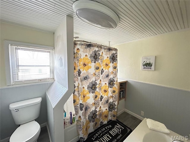 705 E Gibbs St, Salem, MO 65560 - bathroom featuring toilet, wood finished floors, a shower with shower curtain, a wainscoted wall, and wood ceiling