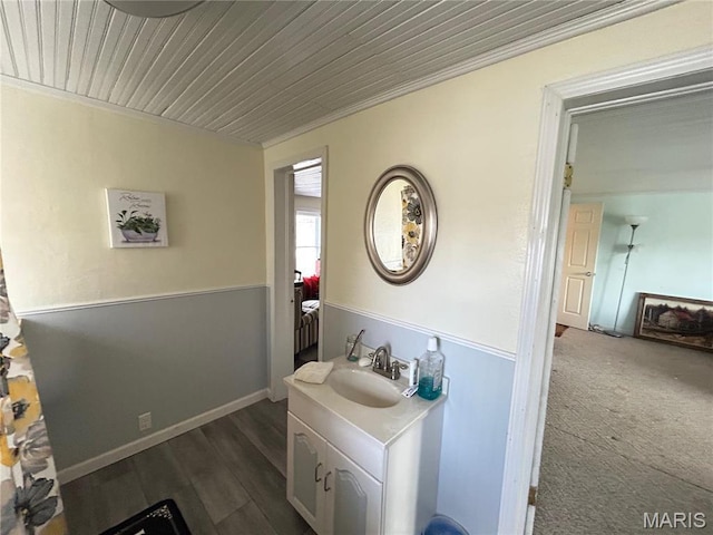 705 E Gibbs St, Salem, MO 65560 - bathroom featuring baseboards, wood finished floors, wooden ceiling, and vanity